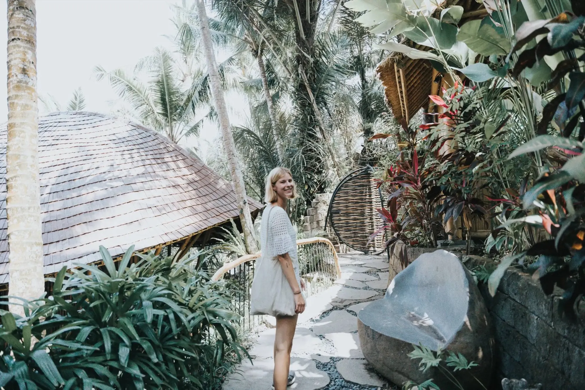 Student walking through a tropical garden on an excursion