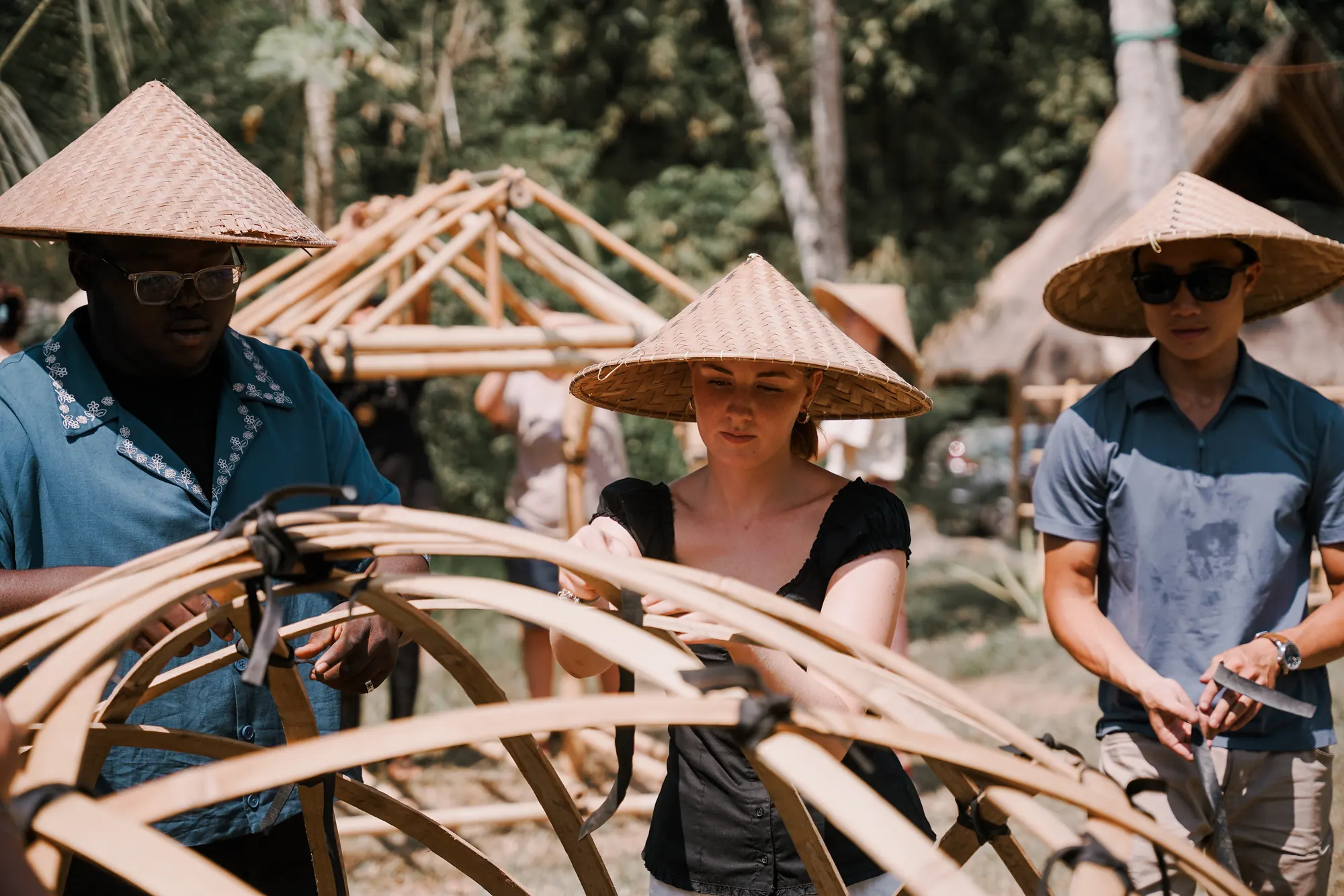 Students building a bamboo gridshell at the Bamboo U construction workshop