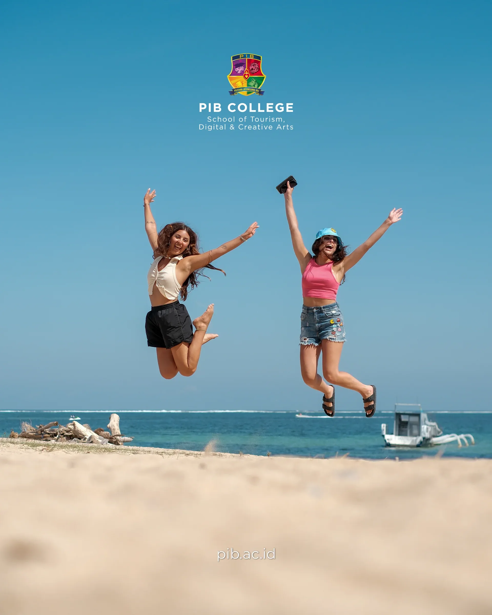Students jumping on a sunny beach