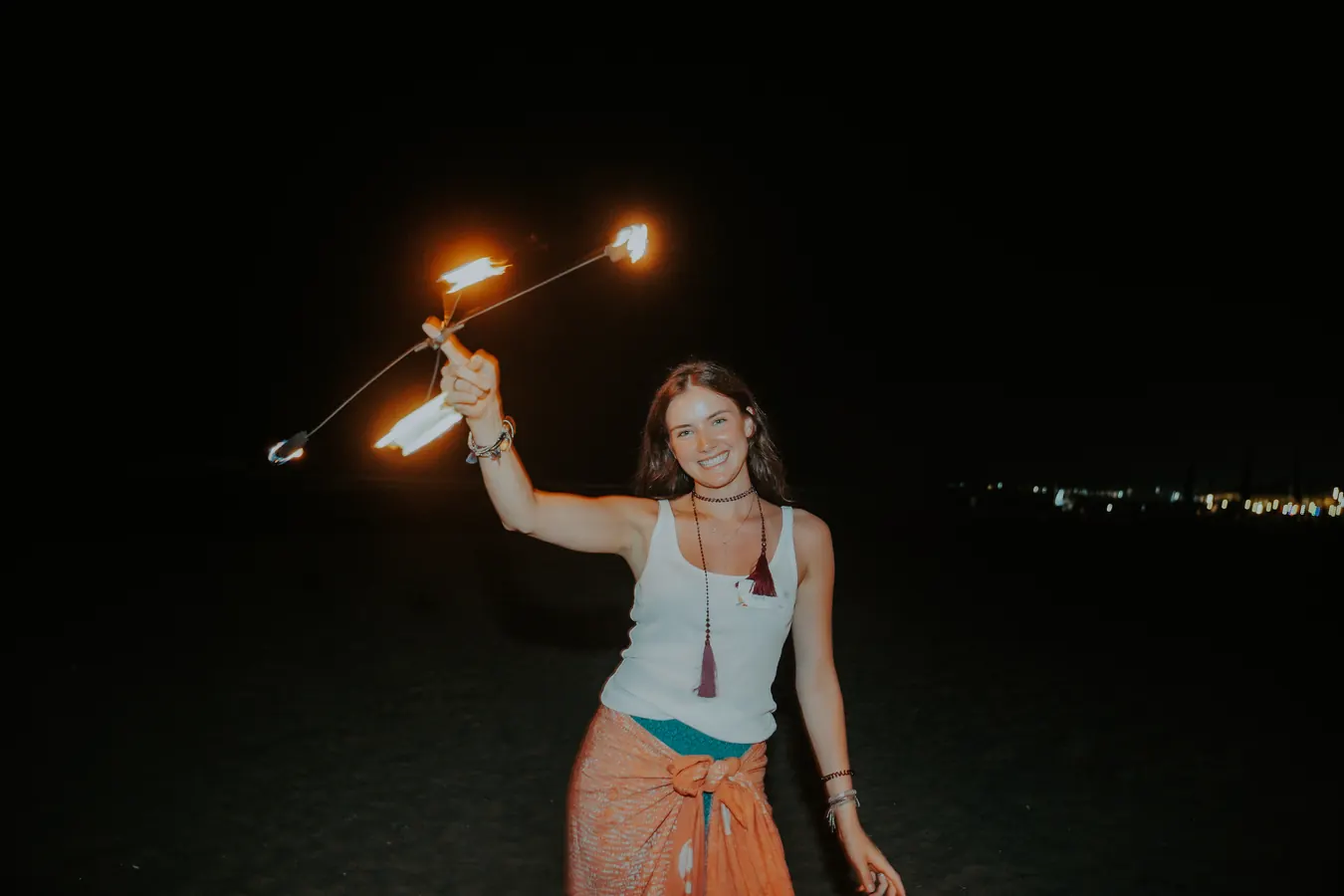 A fire dancer at the welcome dinner