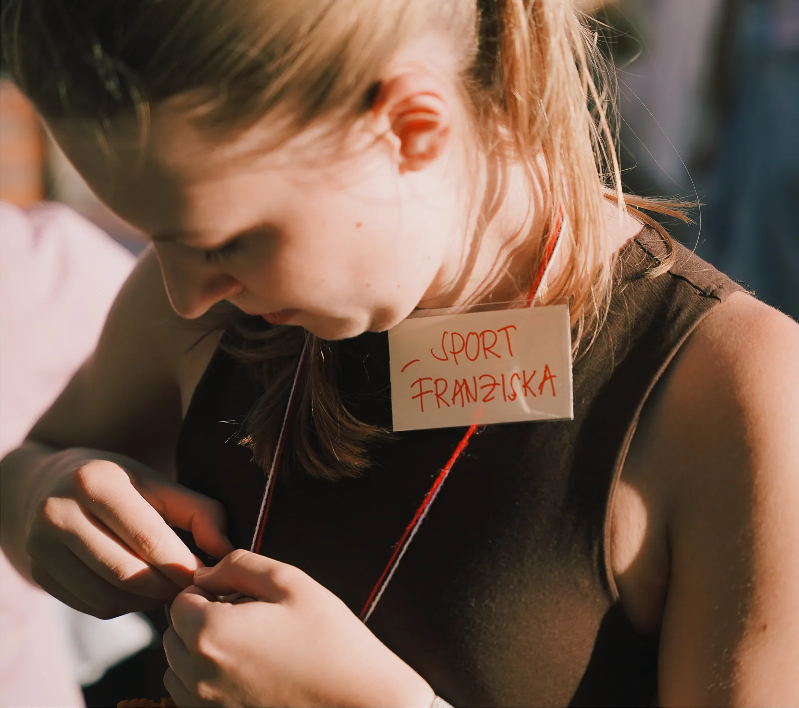 A handwritten name tag reading Sport, Franziska