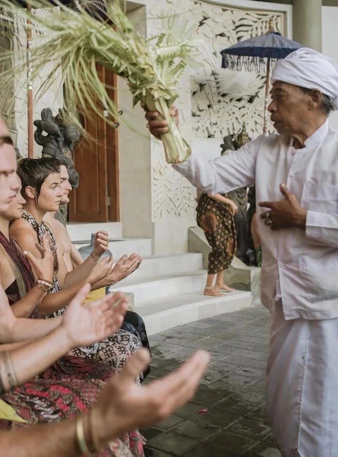 Students taking part in a Balinese blessing ceremony