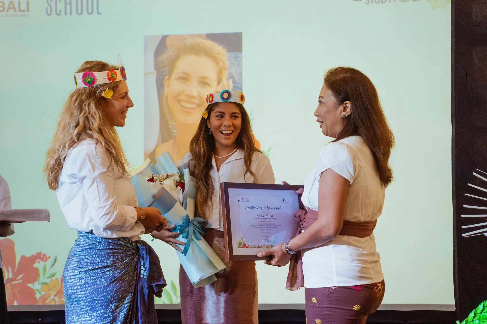 A student receiving their certificate at the closing ceremony