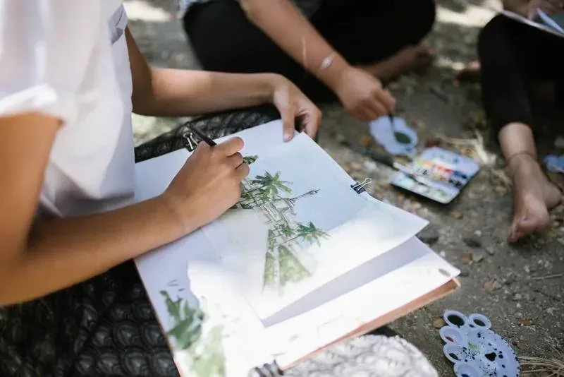 Students sketching a Balinese temple in watercolor during the Southeast Asian Architecture semester