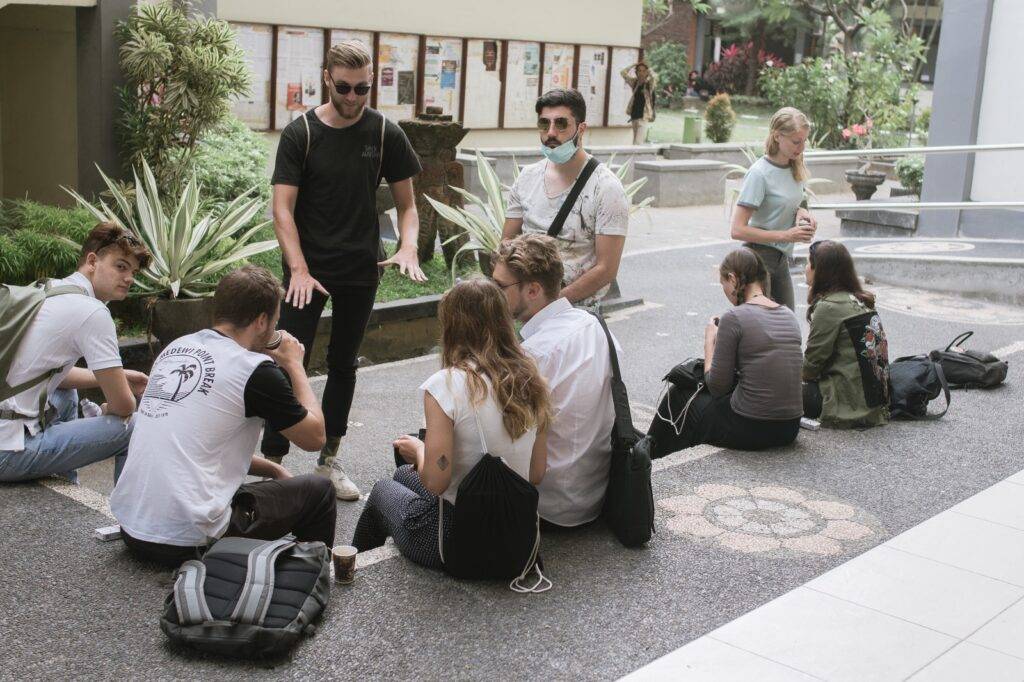 International students from the Southeast Asian Architecture and Southeast Asian Engineering study abroad programs at Universitas Udayana (UNUD) sitting in front of the Tropical Engineering Building on Sudirman Campus.